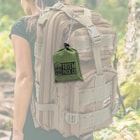 Full image of the Camping Rain Poncho in its carrying bag hanging on a backpack.